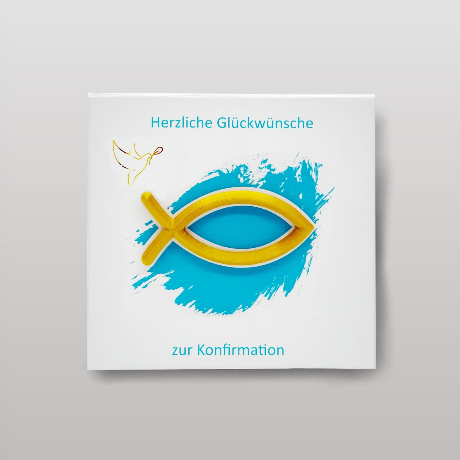 Draufsicht auf eine weiße Magnet-Geschenkbox zur Konfirmation. In der Mitte befindet sich ein erhabenes goldenes 3D-Fischsymbol auf einem türkisblauen Farbakzent. Darüber steht ‚Herzliche Glückwünsche‘, darunter ‚zur Konfirmation‘. Links ist eine kleine Taube als feines Symbol dargestellt.