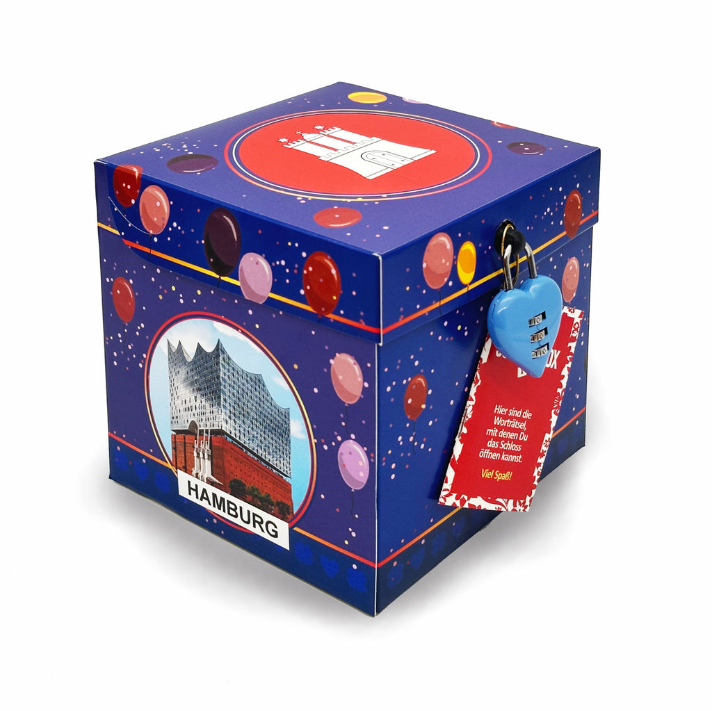 Rätselbox Geburtstag Hamburg im blauen Ballon-Design mit Motiv der Elbphilharmonie, verschlossen mit blauem Herz-Zahlenschloss und Rätselkarte.