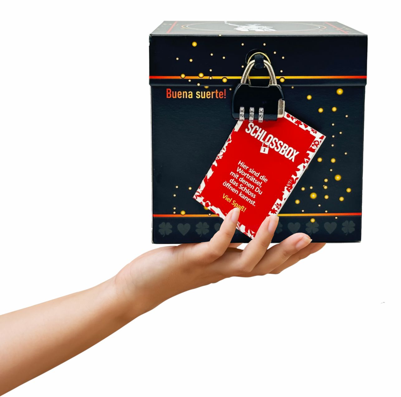 Rätselbox Glück, schwarz mit goldenen Sprenkeln mit Motiv Hermannsdenkmal Rätselheftchen und Zahlenschloss auf einer Hand gehalten. Schriftzug: Buena Suerte.