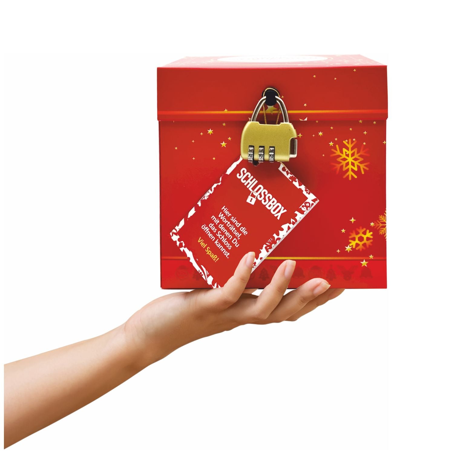 Rätselbox Weihnachten Hermannsdenkmal in Rot mit goldenen Sternmotiven, goldenem Zahlenschloss und rotem Rätselheft-Anhänger, präsentiert auf einer Hand, auf weißem Hintergrund.