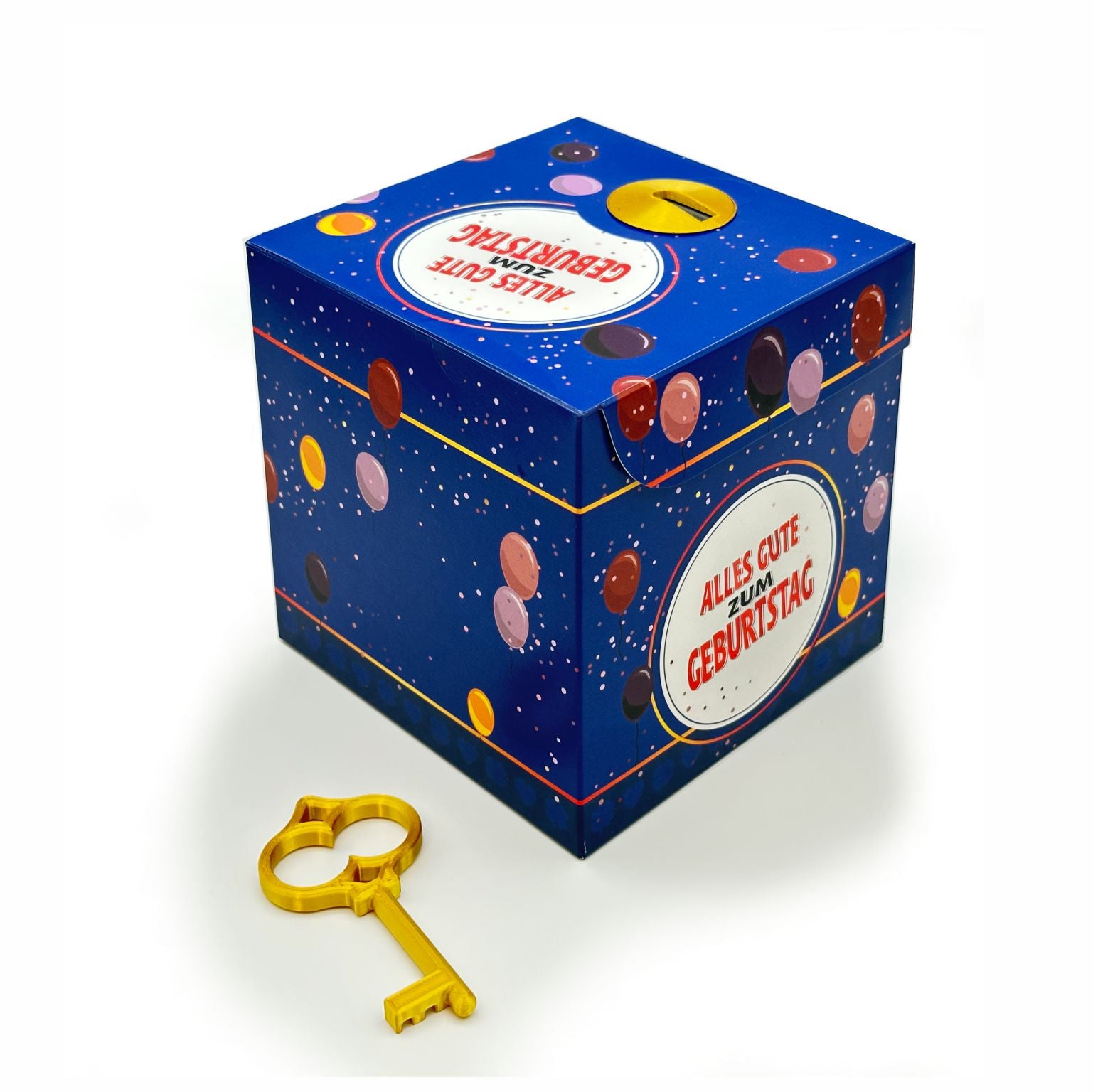 Geschlossene Schlossbox Geburtstag in Blau mit bunten Ballonmotiven und rundem Schriftzug ‚Alles Gute zum Geburtstag‘, davor liegend ein goldener Schlüssel auf weißem Hintergrund.