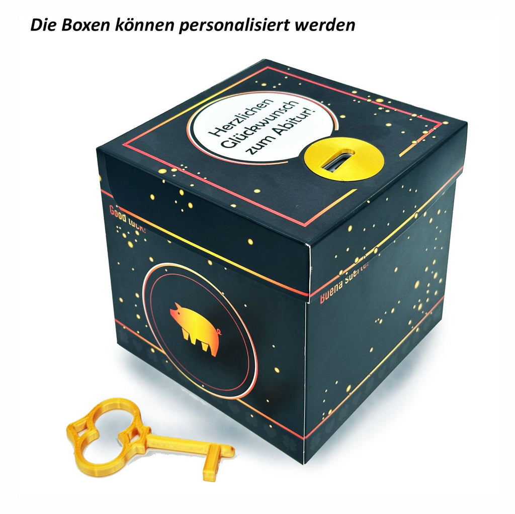 Schlossbox Glück in Schwarz mit goldenen Sprenkeln und Glücksschweinchen auf der Seite, personalisiert mit dem Schriftzug ‚Herzlichen Glückwunsch zum Abitur!‘ auf dem Deckel, goldener Schlüssel liegt vor der Box.